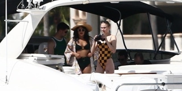 Priyanka Chopra and Sophie Turner leave by boat with their husband and fiancé, Nick and Joe Jonas. The group looked casual as it was preparing for its fun day on the water. Kevin Jonas is joined to them with other family members and friends.