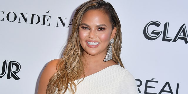 Chrissy Teigen said that she `` is okay with not being able to wear again. ''