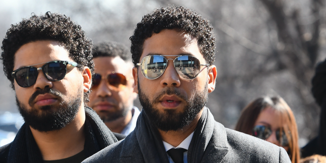 "Empire" actor Jussie Smollett, center, when he arrived at Leighton Criminal Court Building on Tuesday, March 12, 2019, in Chicago.(AP Photo/Matt Marton)