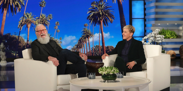 In this March 7, 2019 photo released by Warner Bros., David Letterman appears with host Ellen DeGeneres during a taping of 'The Ellen DeGeneres Show' in Los Angeles. 