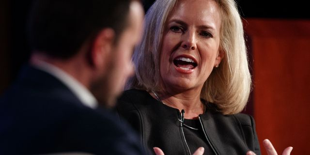 Homeland Security Secretary Kirstjen Nielsen, joined by director of Auburn University's McCrary Institute for Cyber and Critical Infrastructure Security, Frank Cilluffo, speaks at George Washington University's Jack Morton Auditorium in Washington, Monday, March 18, 2019 (AP Photo/Carolyn Kaster)