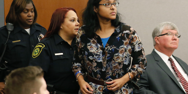 FILE - In this Nov. 29, 2017 file photo Sini Mathews, mother of Sherin Mathews, appears in court at the Henry Wade Juvenile Justice Building in Dallas. The Dallas County District Attorney's Office said in a statement Friday, March 1, 2019, that its dropping the child-abandonment charge against 36-year-old Mathews for lack of evidence for the killing of her 3-year-old daughter. Her husband remains jailed and accused of killing the girl, Sherin Mathews.(David Woo/The Dallas Morning News via AP, Pool File)