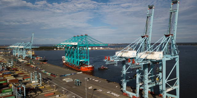FILE- In this Jan. 7, 2019, file photo a Chinese ship carrying giant cranes approaches the pier at Virginia International GatewayTerminal in Portsmouth, Va. On Wednesday, March 27, the Commerce Department reports on the U.S. trade gap for January. (AP Photo/Steve Helber, File)