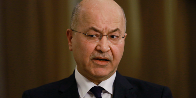 Iraq's President Barham Salih speaks during an interview with The Associated Press in Baghdad, Iraq, Friday, March 29, 2019. Salih says he does not see any "serious" opposition when it comes to the presence of American forces in Iraq as long as they are there for the specific mission of assisting in the fight against the Islamic State group. (AP Photo/Khalid Mohammed)