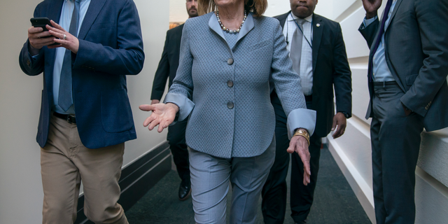 House Speaker Nancy Pelosi, D-Calif., walks to a Democratic Caucus meeting at the Capitol in Washington, Tuesday, March 26, 2019. (AP Photo/J. Scott Applewhite)