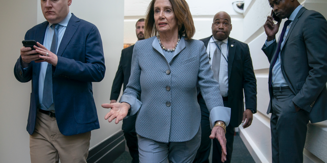 House Speaker Nancy Pelosi, D-Calif., walks to a Democratic Caucus meeting at the Capitol in Washington, Tuesday, March 26, 2019. (AP Photo/J. Scott Applewhite)