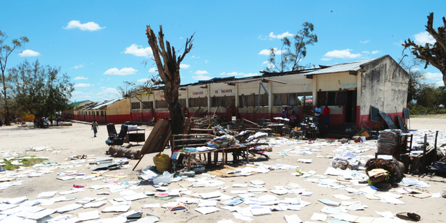 School books at Inchope primary school in Inchope, Mozambique, are left to dry in the sun after the school was damaged by Cyclone Idai, Monday March, 25, 2019. Cyclone Idai's death toll has risen above 750 in the three southern African countries hit 10 days ago by the storm, as workers rush to restore electricity, water and try to prevent outbreak of cholera. (AP Photo/Tsvangirayi Mukwazhi)