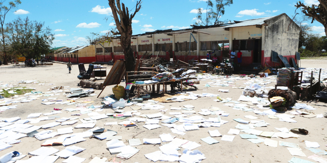 School books at Inchope primary school in Inchope, Mozambique, are left to dry in the sun after the school was damaged by Cyclone Idai, Monday March, 25, 2019. Cyclone Idai's death toll has risen above 750 in the three southern African countries hit 10 days ago by the storm, as workers rush to restore electricity, water and try to prevent outbreak of cholera. (AP Photo/Tsvangirayi Mukwazhi)