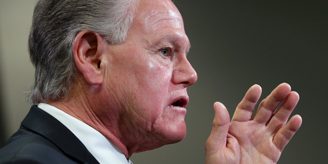 FILE - In this June 8, 2018 file photo, former Maricopa County Attorney Rick Romley speaks at Mesa Police headquarters in Mesa, Ariz. Romley says he quit an internal investigation of a health care facility where an incapacitated woman was raped and later gave birth because of concerns about its leadership. (AP Photo/Matt York, File )