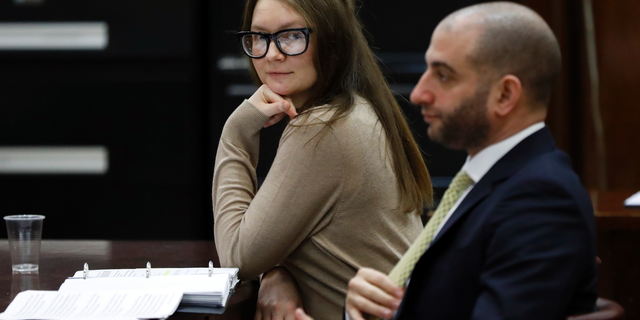 Anna Sorokin and her attorney Todd Spodek sit at the defense table after a recess in her trial in New York State Supreme Court, Wednesday, March 27, 2019, in New York. Sorokin, who claimed to be a German heiress, is on trial on grand larceny and theft of services charges. (AP Photo/Richard Drew)