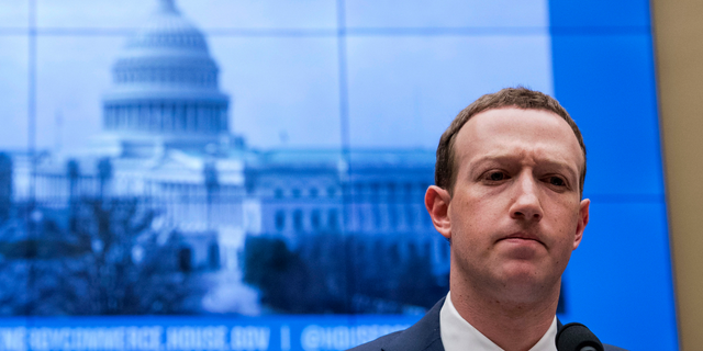 FILE - In this April 11, 2018, file photo, Facebook CEO Mark Zuckerberg pauses while testifying before a House Energy and Commerce hearing on Capitol Hill in Washington about the use of Facebook data to target American voters in the 2016 election and data privacy. Zuckerberg said Facebook will start to emphasize new privacy-shielding messaging services, a shift apparently intended to blunt both criticisms of the company's data handling and potential antitrust action. (AP Photo/Andrew Harnik, File)