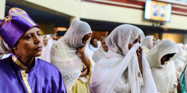 Members of the Ethiopian community taking part in a special prayer for the victims of the Ethiopian Airlines flight ET302 crash, at the Ethiopian Orthodox Tewahedo Church of Canada Saint Mary Cathedral in Toronto, on Sunday. (Christopher Katsarov/The Canadian Press via AP)