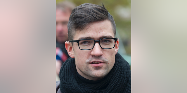 File--- In this picture taken Nov.5, 2016 Martin Sellner, leader of the right-wing populist Identitarian movement of Austria is seen giving an interview in Berlin, Germany. (Paul Zinken/dpa via AP)