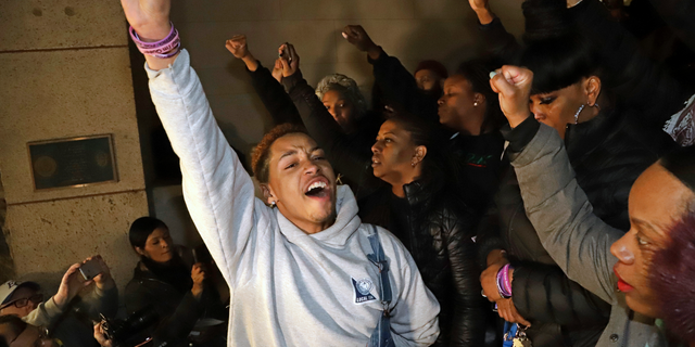 Supporters of Antwon Rose II, stand on the steps of Allegheny County Courthouse after hearing the verdict of not guilty on all charges for Michael Rosfeld, a former police officer in East Pittsburgh, Pa., Friday, March 22, 2019.