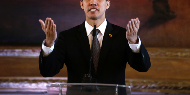 Venezuela's self-proclaimed interim president Juan Guaido talks during a joint press conference with his Paraguayan counterpart during an official visit, in Asuncion, Paraguay, Friday, March 1, 2019. Guaido met with Paraguay's President Abdo Benitez, who recognizes Guaido as Venezuela's leader and has taken a hard line against Venezuelan President Nicolas Maduro. (AP Photo/Jorge Saenz)