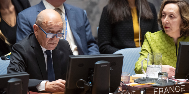 Jean-Yves Le Drian, United Nations Security Council president, speaks at the UN headquarters about threats to international peace and security caused by terrorist acts, Thursday, March 28, 2019. The U.N. Security Council has unanimously adopted a resolution aimed at strengthening global efforts to combat the numerous and new ways that terrorist groups raise funds to finance their operations. The French-drafted resolution approved Thursday orders all countries to ensure that their domestic laws are sufficient to prosecute and penalize those responsible for directly or indirectly financing "terrorist organizations or individual terrorists for any purpose." At right is Hasmik Egian, Director of the Security Council Affairs Division of the Department of Political and Peacebuilding Affairs. (Eskinder Debebe/United Nations via AP)