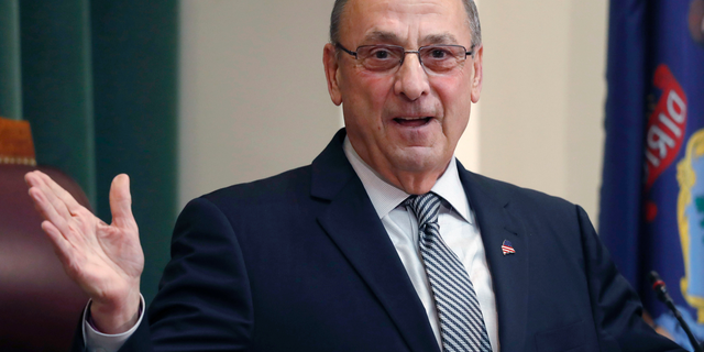 FILE - In this Feb. 13, 2018, file photo, Gov. Paul LePage delivers the State of the State address to the Legislature at the State House in Augusta, Maine. In March 2019 the state released a list of the 115 people pardoned by former Gov. LePage following a public records request by The Associated Press. (AP Photo/Robert F. Bukaty, File)