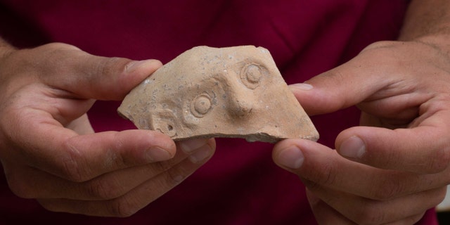 The fragment is part of a jar known as a “Bes-vessel.” (Eliyahu Yanai, City of David)