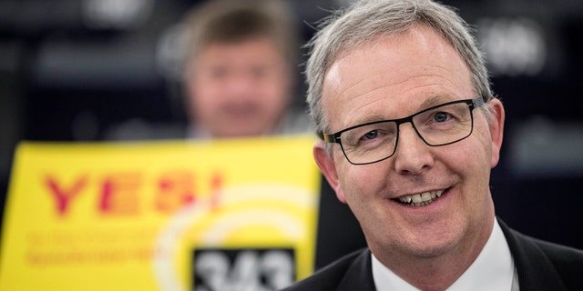 Axel Voss, Member of the European Parliament and rapporteur of the copyright bill, poses for the media at the European Parliament in Strasbourg, France, Tuesday March 26, 2019. The European Parliament is furiously debating the pros and cons of a landmark copyright bill one last time before the legislature will vote on it later. (AP Photo/Jean-Francois Badias)