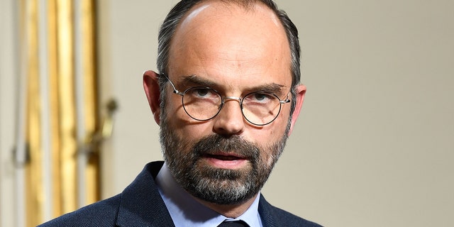 French Prime Minister Edouard Philippe (L) gives a press conference, on March 18, 2019 at the Matignon hotel in Paris, to announce measures after weekend riots. (Photo by Bertrand GUAY / AFP) (Photo credit should read BERTRAND GUAY/AFP/Getty Images)
