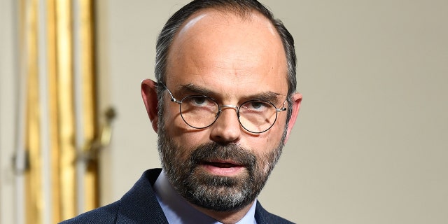 French Prime Minister Edouard Philippe (L) gives a press conference, on March 18, 2019 at the Matignon hotel in Paris, to announce measures after weekend riots. (Photo by Bertrand GUAY / AFP) (Photo credit should read BERTRAND GUAY/AFP/Getty Images)