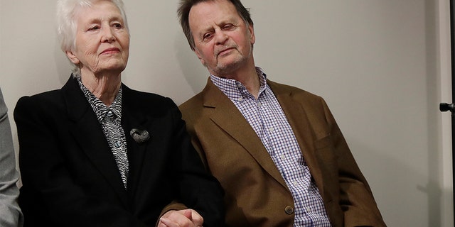 Edwin Hardeman, right, sits with his wife, Mary, at a news conference in San Francisco, Wednesday. (AP Photo/Jeff Chiu)