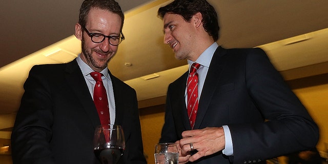 Justin Trudeau speaks to his former adviser Gerald Butts back in 2015. At one point Butts was considered the most powerful person in the Prime Minister's Office, but he abruptly resigned last month.