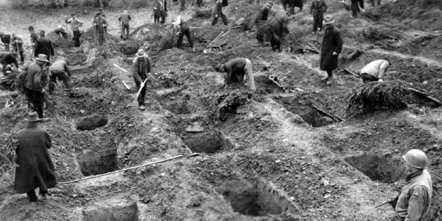 File photo - The reburial of the massacre victims supervised by U.S. forces.