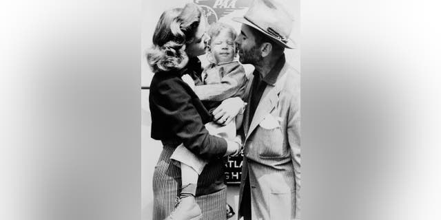 Humphrey Bogart And Lauren Bacall with their son. — Getty