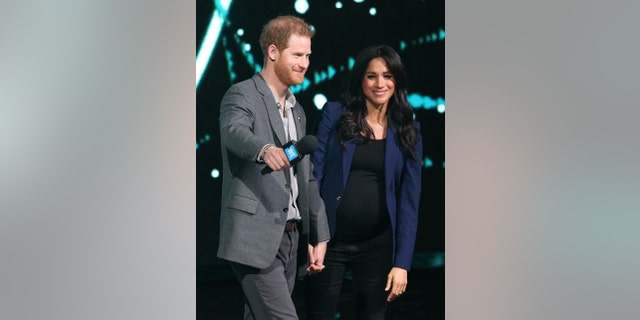 The Duke of Sussex and the Duchess of Sussex during his visit to WE Day UK at the SSE Arena in Wembley, London.