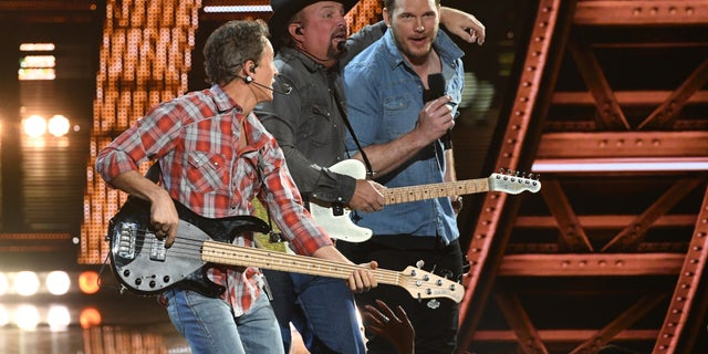 Garth Brooks and Chris Pratt perform on stage at the 2019 iHeartRadio Music Awards which broadcasted live on FOX from the Microsoft Theater in Los Angeles on Thursday.