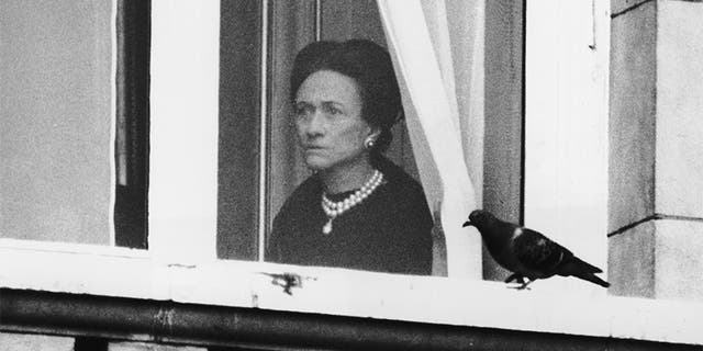 The Duchess of Windsor (1896 - 1986) watches the start of the Trooping the Colour ceremony from a first-floor window of Buckingham Palace, June 3, 1972. A one minute silence was observed for the Duke of Windsor, who had died in Paris the week before.