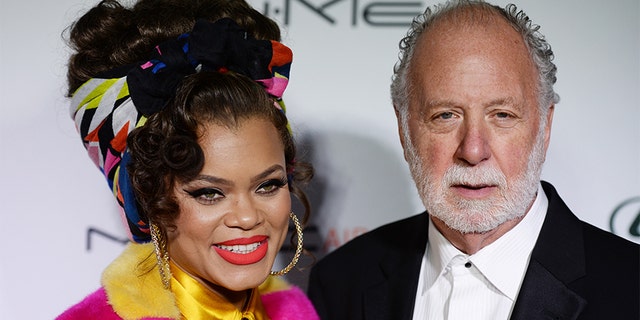 Singer Andra Day (L) and record producer Adrian Gurvitz arrive at the 3rd Annual Hollywood Beauty Awards at Avalon Hollywood on Feb. 19, 2017 in Los Angeles, Calif. — Getty