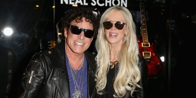 Guitarist Neal Schon (L) of Journey and his wife, tv  property   Michaele Schon sued Live Nation for affectional  distress successful  2019.