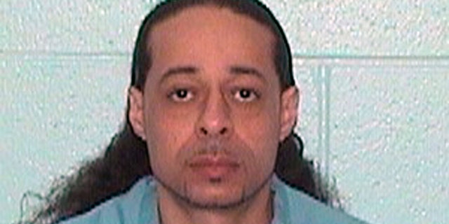 This undated booking photo released by Illinois Department of Corrections shows Floyd E. Brown. Illinois State Police say Brown, 39, suspected of shooting a sheriff's deputy and a woman Thursday, March 7, 2019 at an Illinois hotel crashed his vehicle along an interstate highway while trying to flee police.