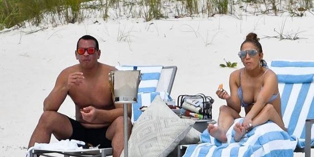 Jennifer Lopez and Alex Rodriguez on the beach