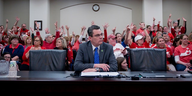 In a classroom filled with teachers last month, Kentucky State Representative Ken Upchurch spoke on a bill that would change the way people are appointed to the board of directors of the pension system. Kentucky teachers. (AP Photo / Bryan Woolston, File)