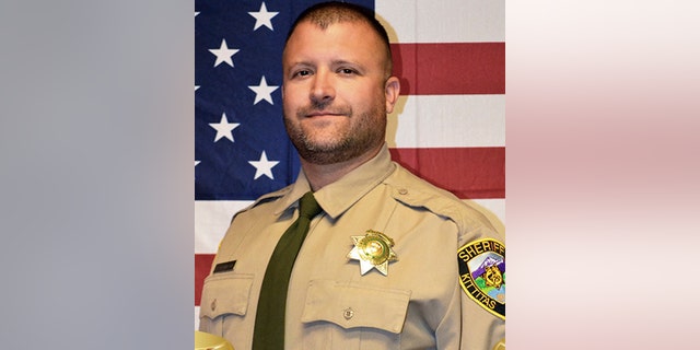 Sheriff's Deputy Ryan Thompson, 42, was shot and killed and a police officer was wounded after they exchanged gunfire with a road rage driving suspect Tuesday, authorities said Wednesday. (Kittitas County Sheriff's Office via AP)