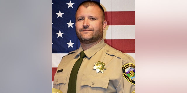 Sheriff's Deputy Ryan Thompson, 42, was shot and killed and a police officer was wounded after they exchanged gunfire with a road rage driving suspect Tuesday, authorities said Wednesday. [Kittitas County Sheriff's Office via AP)