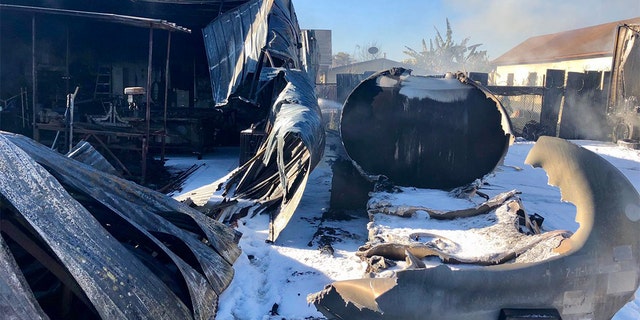 A view of the tanker and charred home during the aftermath of the gas explosion near Los Angeles.