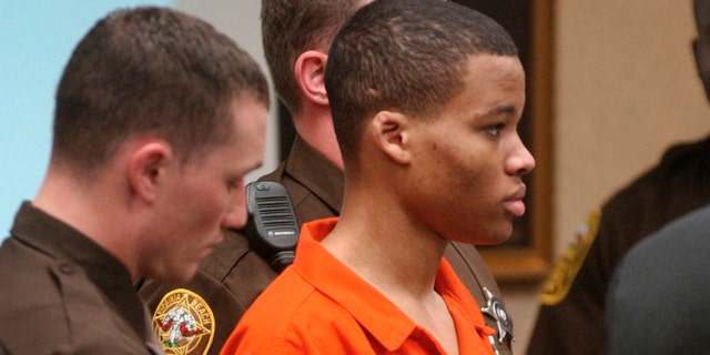 FILE - In this Oct. 20, 2003 file photo, Lee Boyd Malvo listens to court proceedings during the trial of fellow sniper suspect John Allen Muhammad in Virginia Beach, Va. (AP Photo/Martin Smith-Rodden, Pool, File)