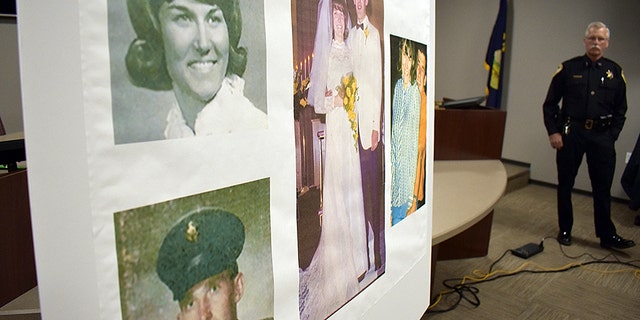 Photos of Linda and Clifford Bernhardt, who were killed in 1973, are displayed at a press conference at the Yellowstone County administrative offices in Billings, Montana on Monday, March 25, 2019. Yellowstone County Sheriff Mike Linder, pictured at right, says authorities have identified the couple's now-deceased killer.