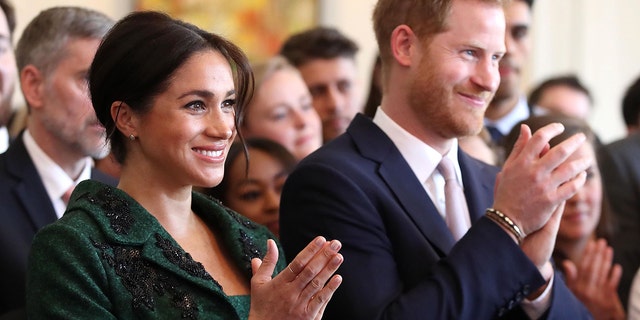 Meghan, Duchess of Sussex, left, and Britain's Prince Harry, Duke of Sussex, watch a musical performance at Canada House, the offices of the High Commission of Canada in the United Kingdom, during an event to mark Commonwealth Day, in central London, on March 11, 2019. (CHRIS JACKSON/AFP/Getty Images)