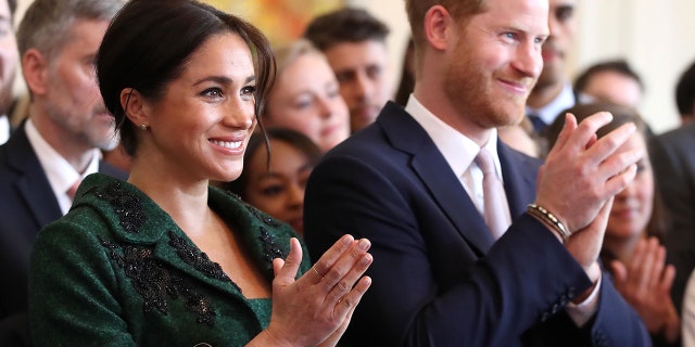 Meghan, Duchess of Sussex, left, and Britain's Prince Harry, Duke of Sussex, watch a musical performance at Canada House, the offices of the High Commission of Canada in the United Kingdom, during an event to mark Commonwealth Day, in central London, on March 11, 2019. (CHRIS JACKSON/AFP/Getty Images)