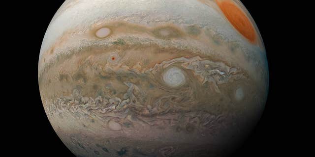 The image shows Jupiter's Great Red Spot and storms in the gas giant's southern hemisphere.