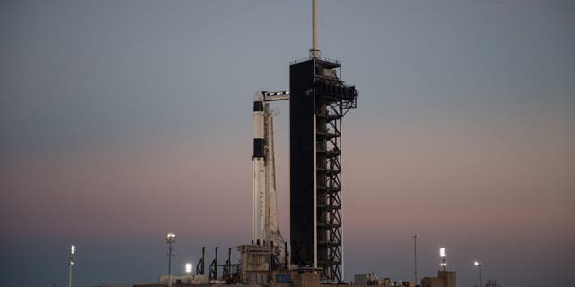 The SpaceX Falcon 9 rocket with the Crew Dragon spacecraft onboard is seen after being raised into a vertical position on the launch pad at Launch Complex 39A Feb. 28, 2019.