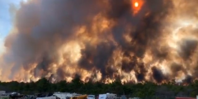 A fire burning through Penn State Forest in Burlington County, New Jersey has sent smoke north, leading residents in New York City to report the smell of smoke.