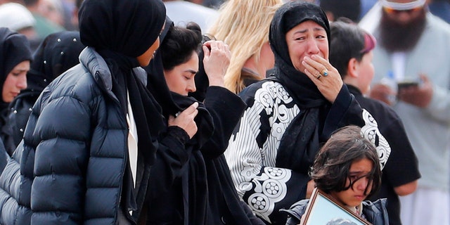 Mourners arrive for a burial service of a victim from the March 15 mosque shootings at the Memorial Park Cemetery in Christchurch, New Zealand on Thursday. (AP Photo/Vincent Thian)