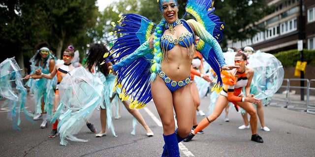 Revelers take part in the Notting Hill Carnival in London, Britain August 27, 2018. REUTERS/Henry Nicholls