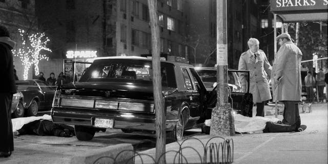 Detectives stand over the body of reputed mob boss Paul Castellano, after his execution outside of Sparks Steakhouse in New York City in 1985. Cali's death Wednesday marked the first time since Castellano's murder that a top-ranking suspected mob figure was killed in the city. (Photo By: Tom Monaster/NY Daily News via Getty Images)